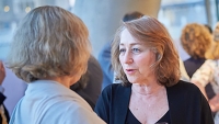 CPTR Faculty members chat during a center event.